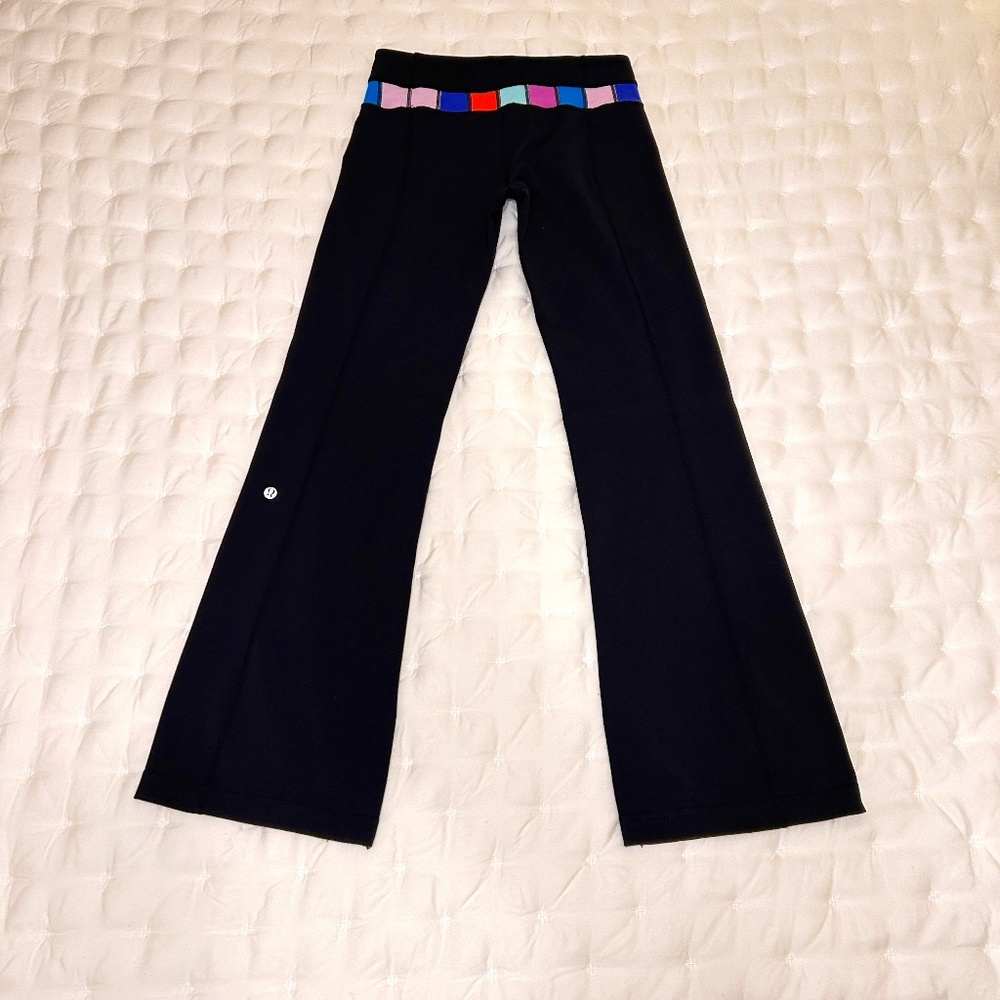 Lululemon Flare Black Stretch pants with Multi-Color Waistband, Size 6 Reg.